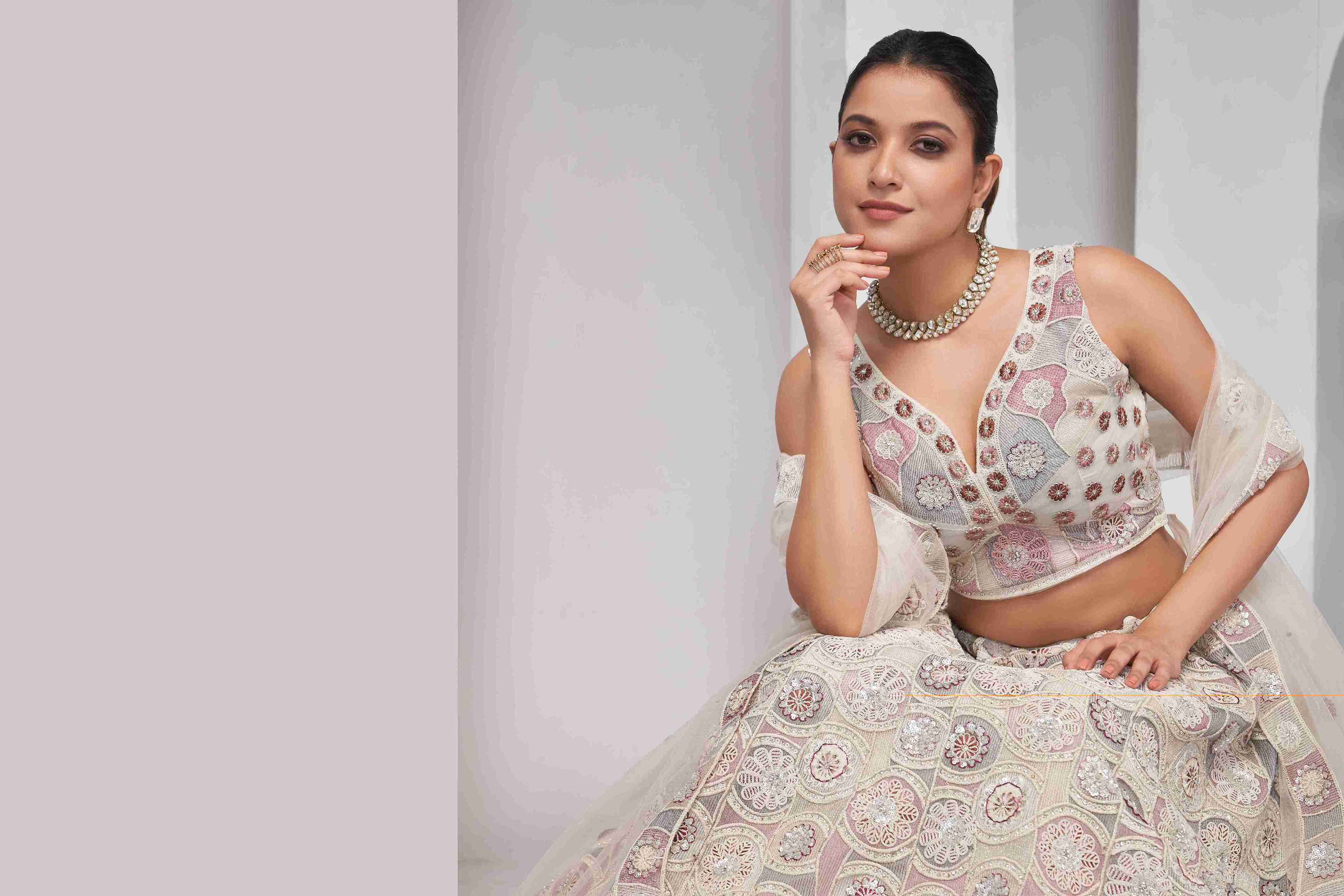 Ivory Net Sequins Lehenga Choli