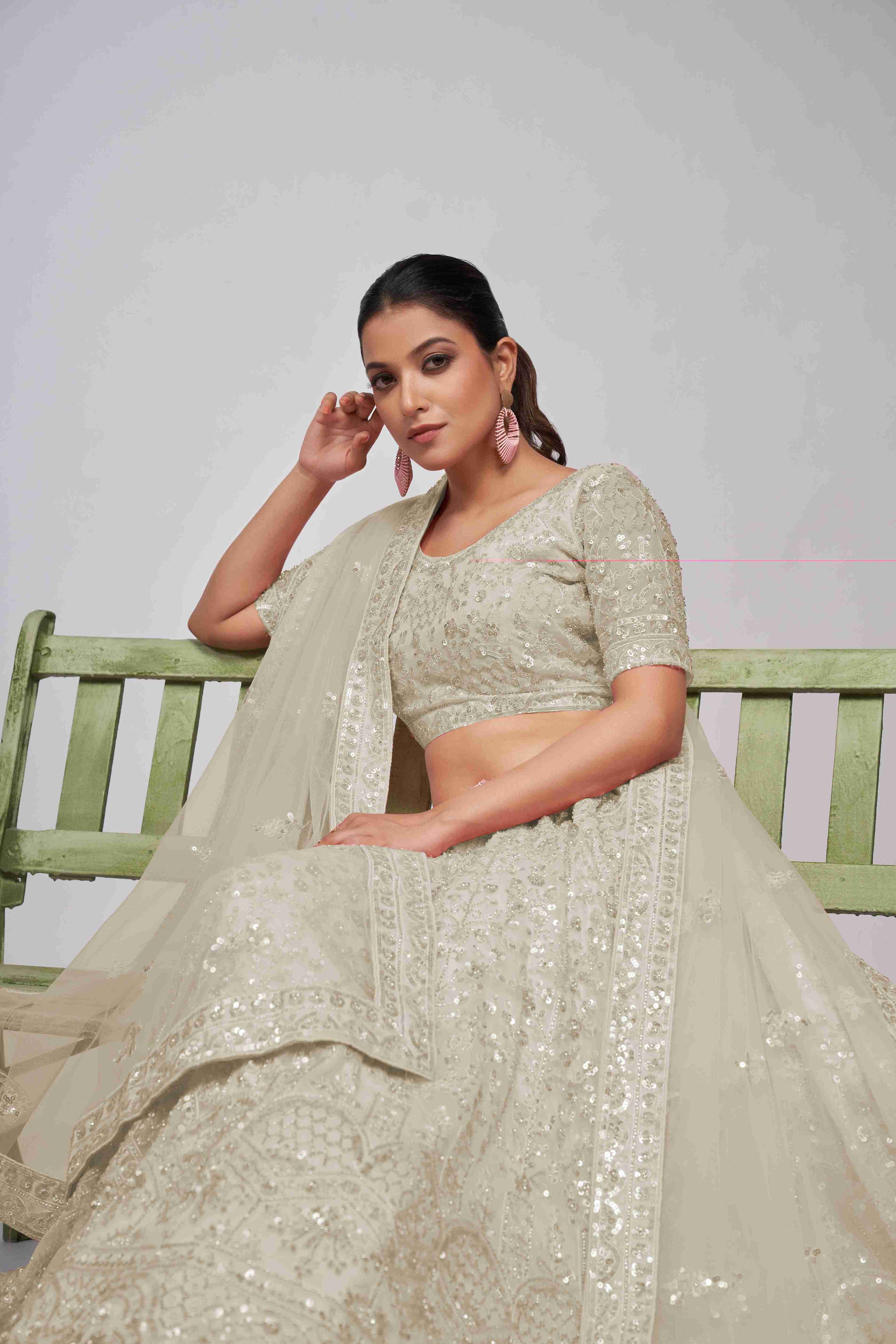 Ivory Net Sequins Cut Dana Work Lehenga Choli