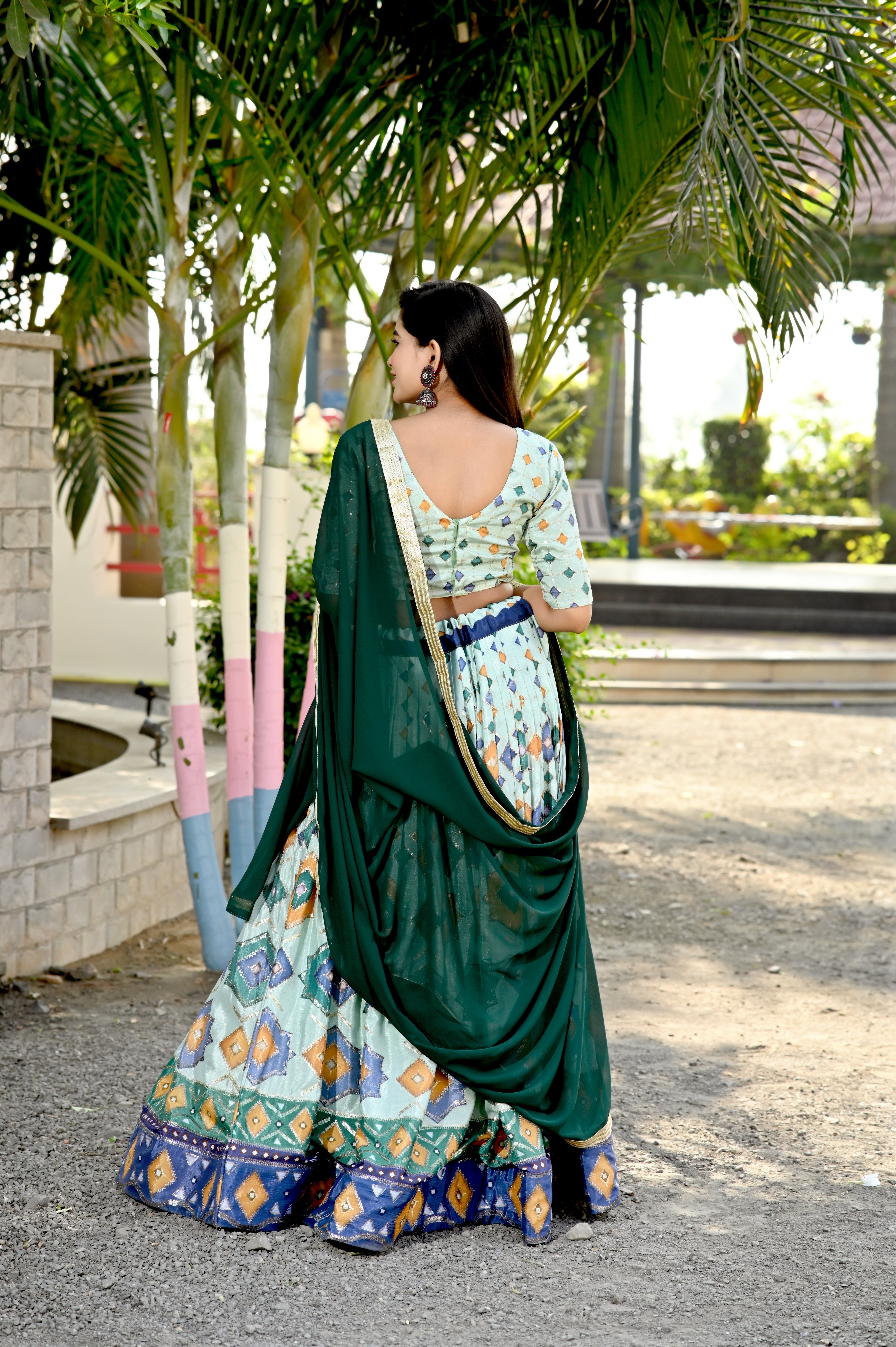 Pista Printed Faux Georgette Lehenga Choli