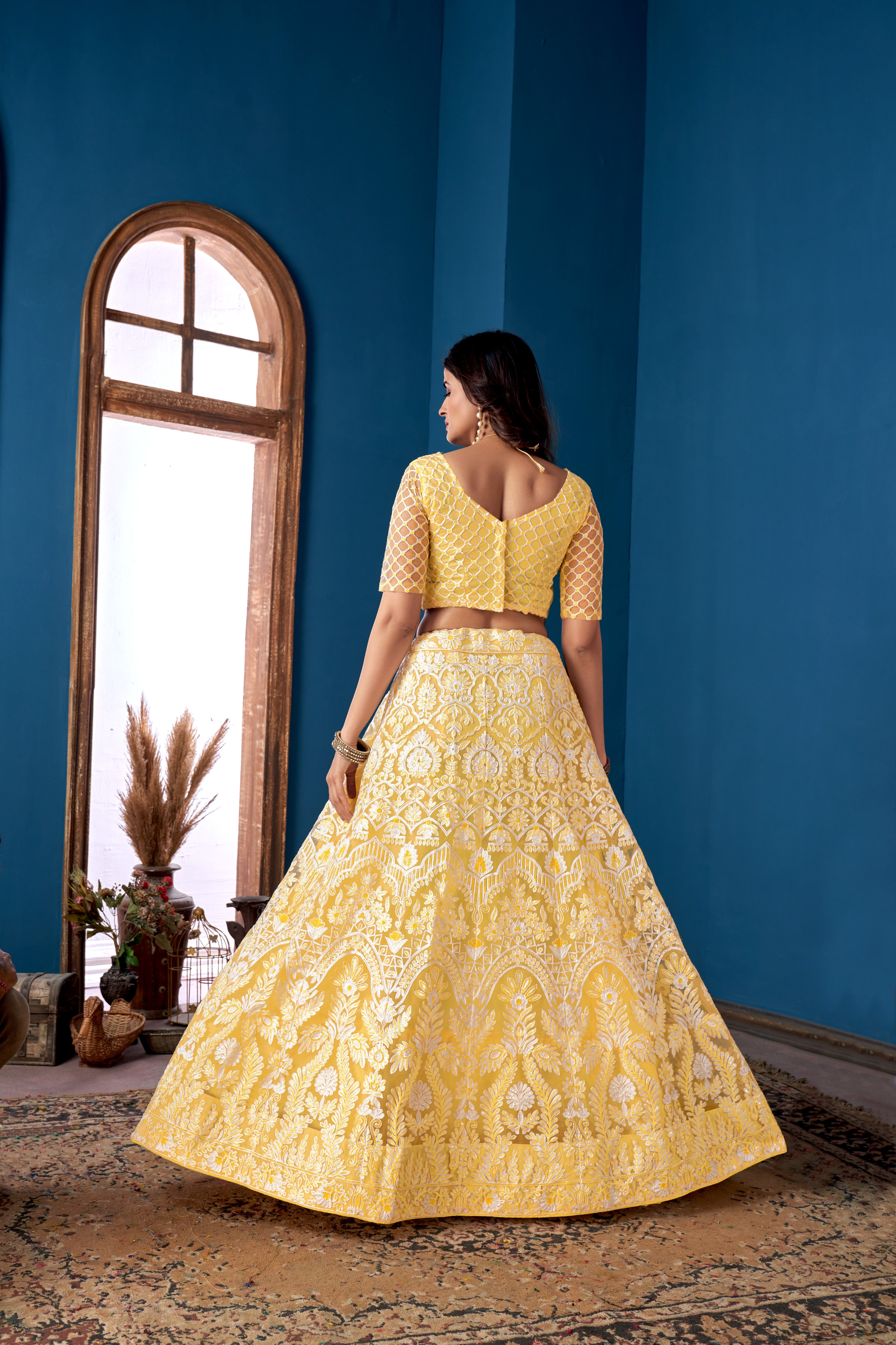 Yellow Net Sequins Embroidered Lehenga Choli