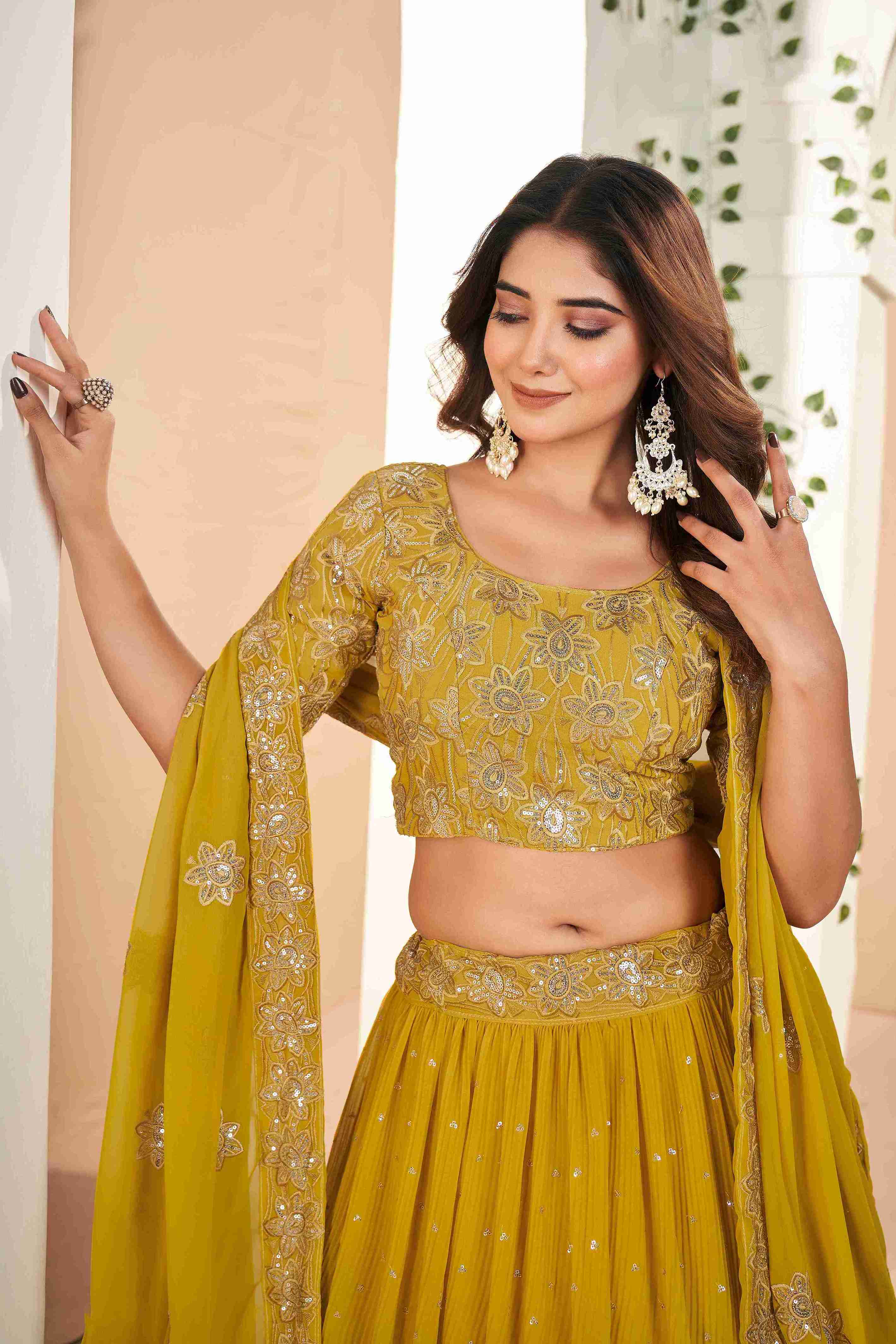 Mustard Faux Georgette Sequins Embroidered Lehenga Choli