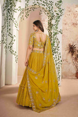 Mustard Faux Georgette Sequins Embroidered Lehenga Choli