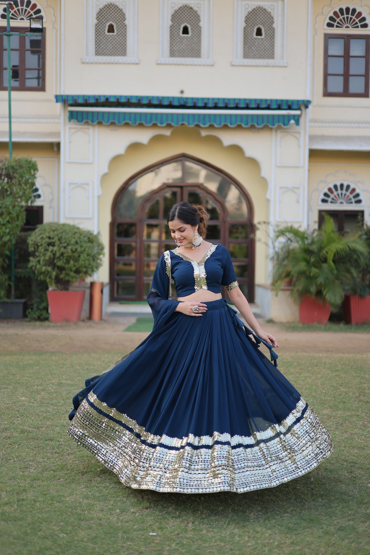 Teal Faux Georgette Sequins Embroidered Lehenga Choli