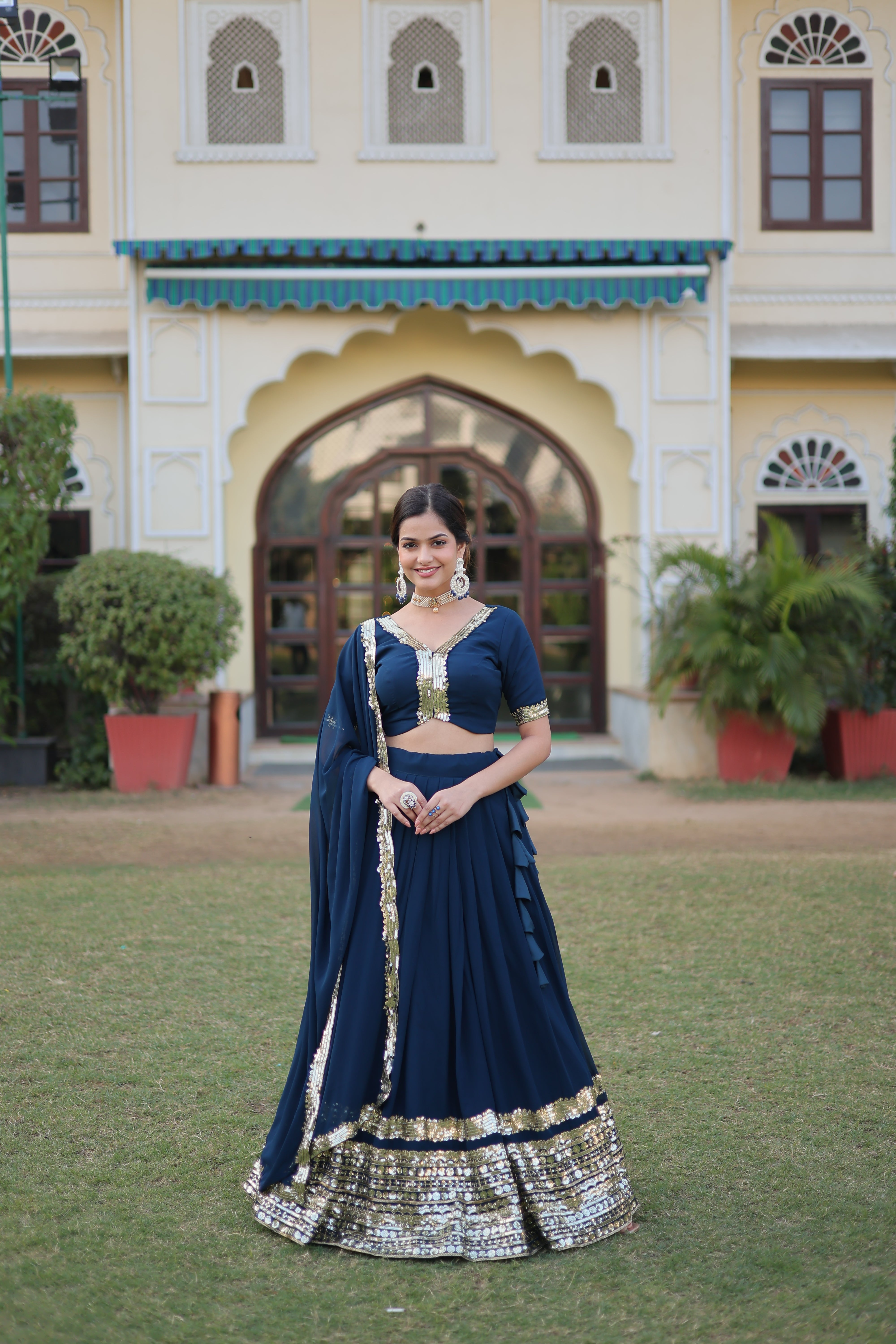 Teal Faux Georgette Sequins Embroidered Lehenga Choli