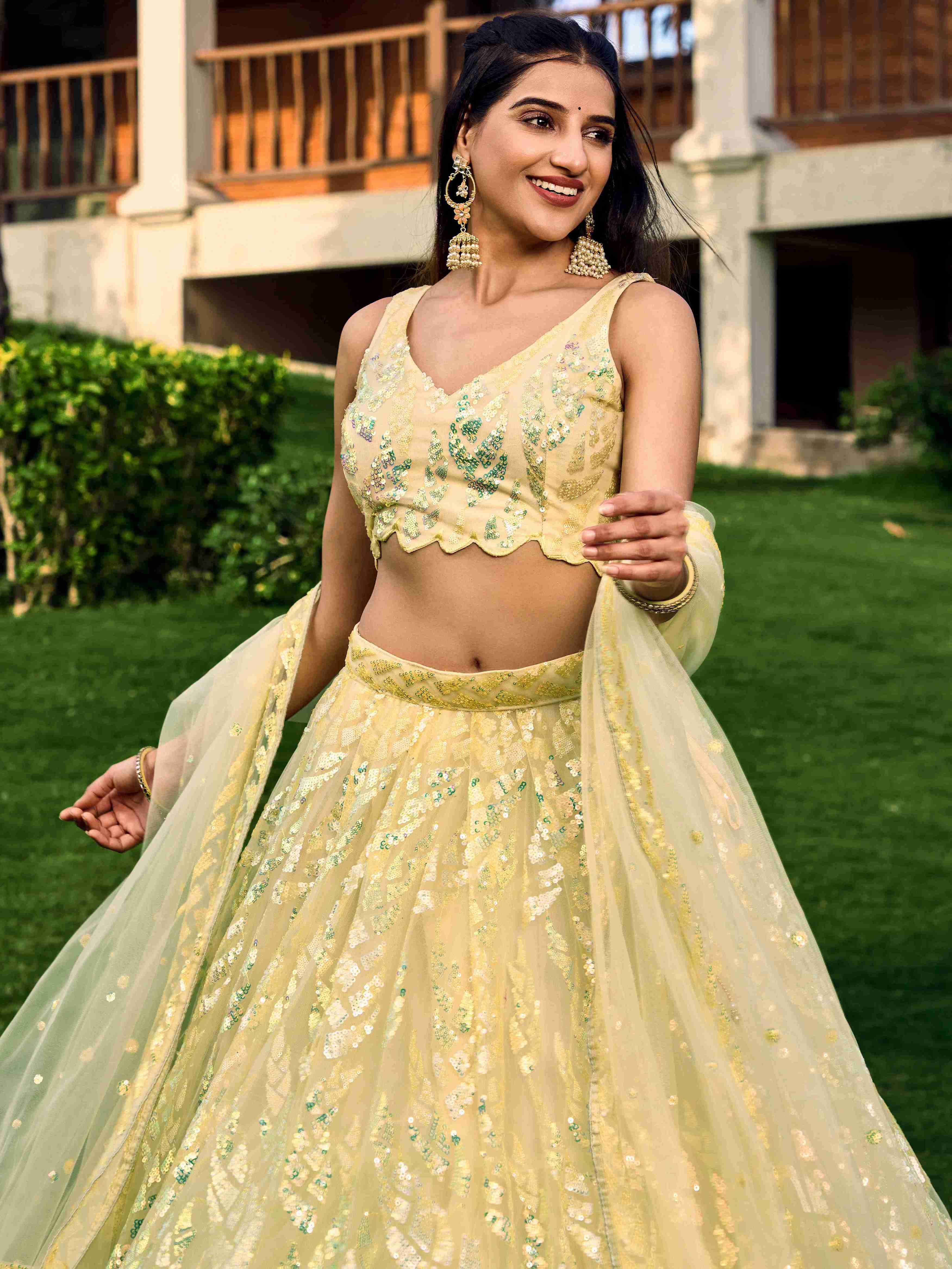 Yellow Soft Net Sequins Embroidered Lehenga Choli