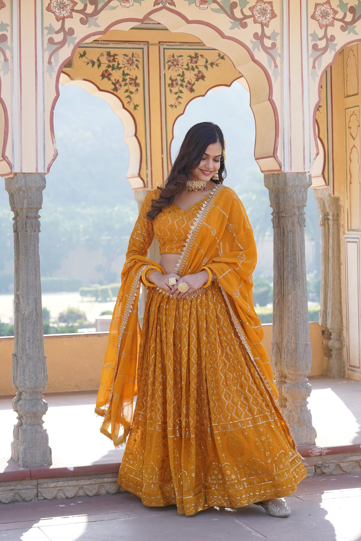 Yellow Faux Georgette Sequins Embroidered Lehenga Choli