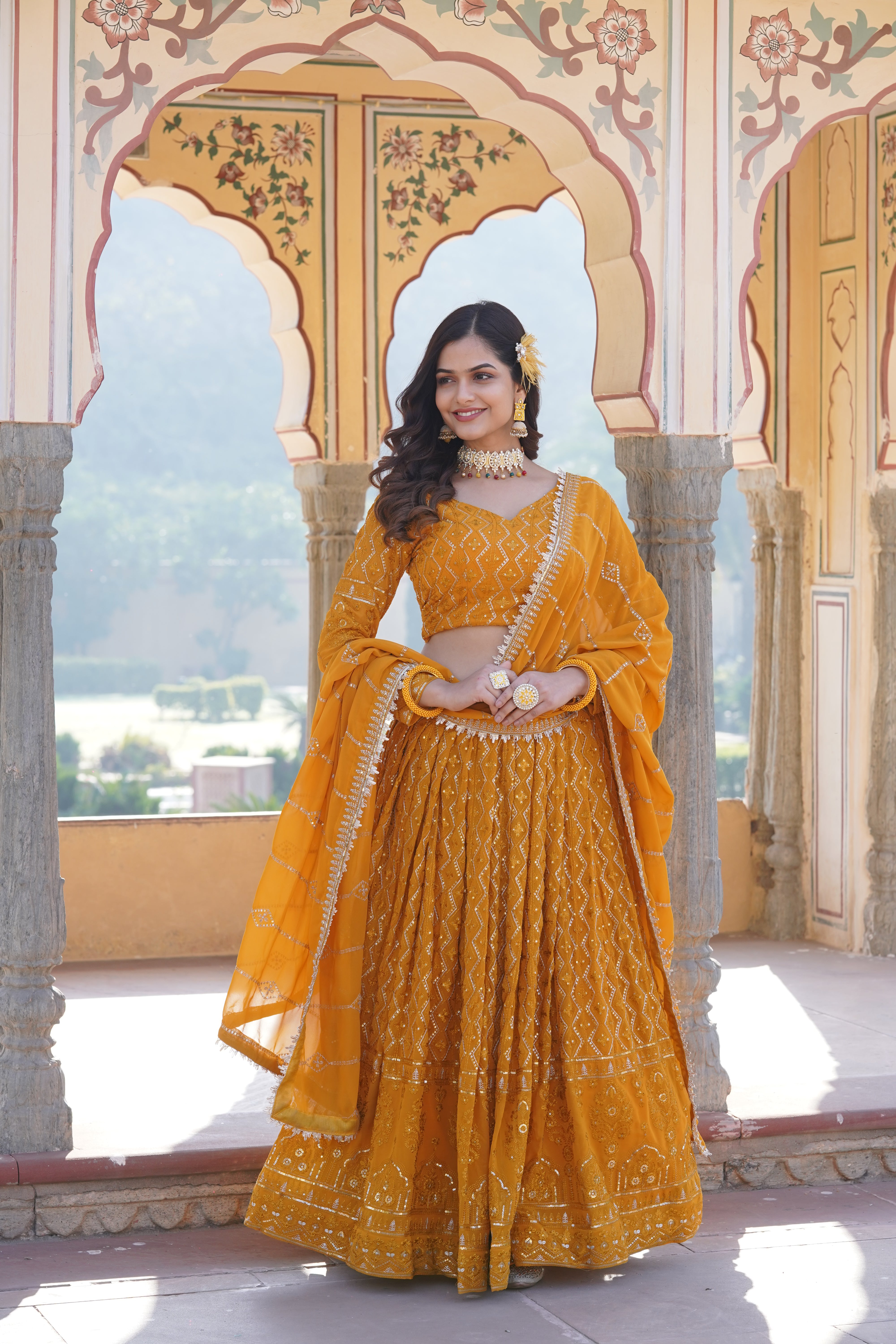 Yellow Faux Georgette Sequins Embroidered Lehenga Choli