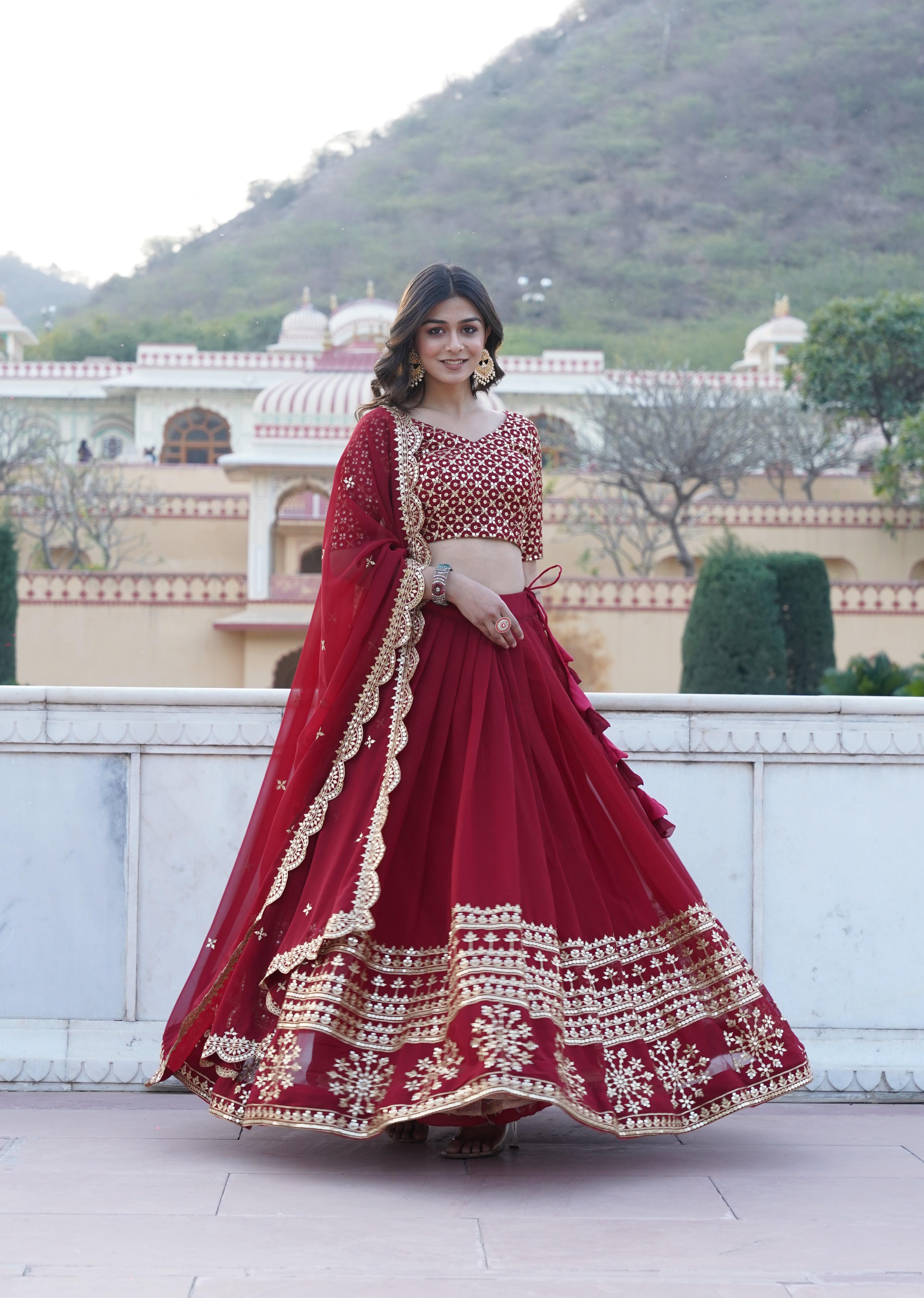 Maroon Faux Georgette Sequins Embroidered Lehenga Choli