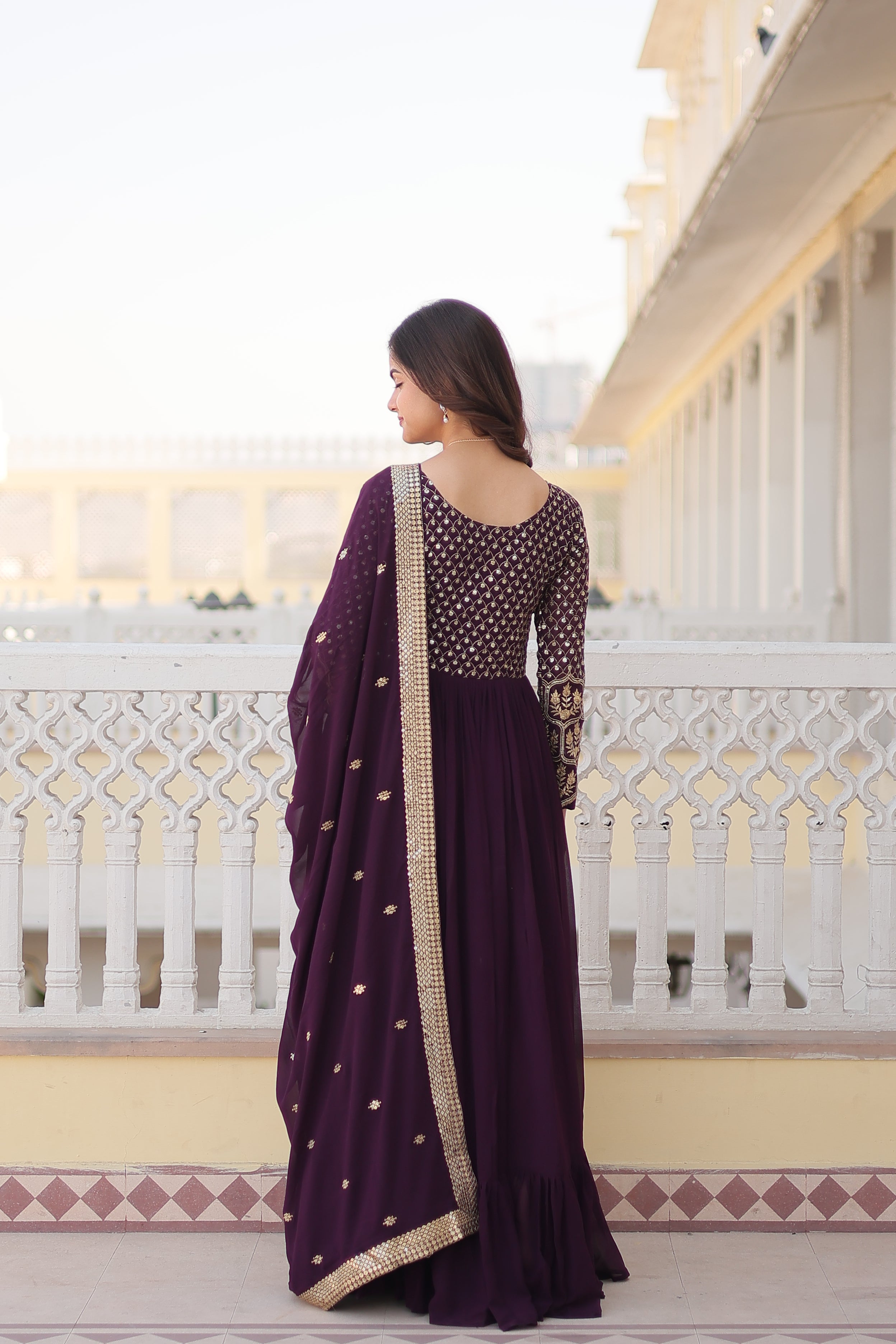 Wine Colored Faux Georgette Sequins Embroidered  Gown With Dupatta