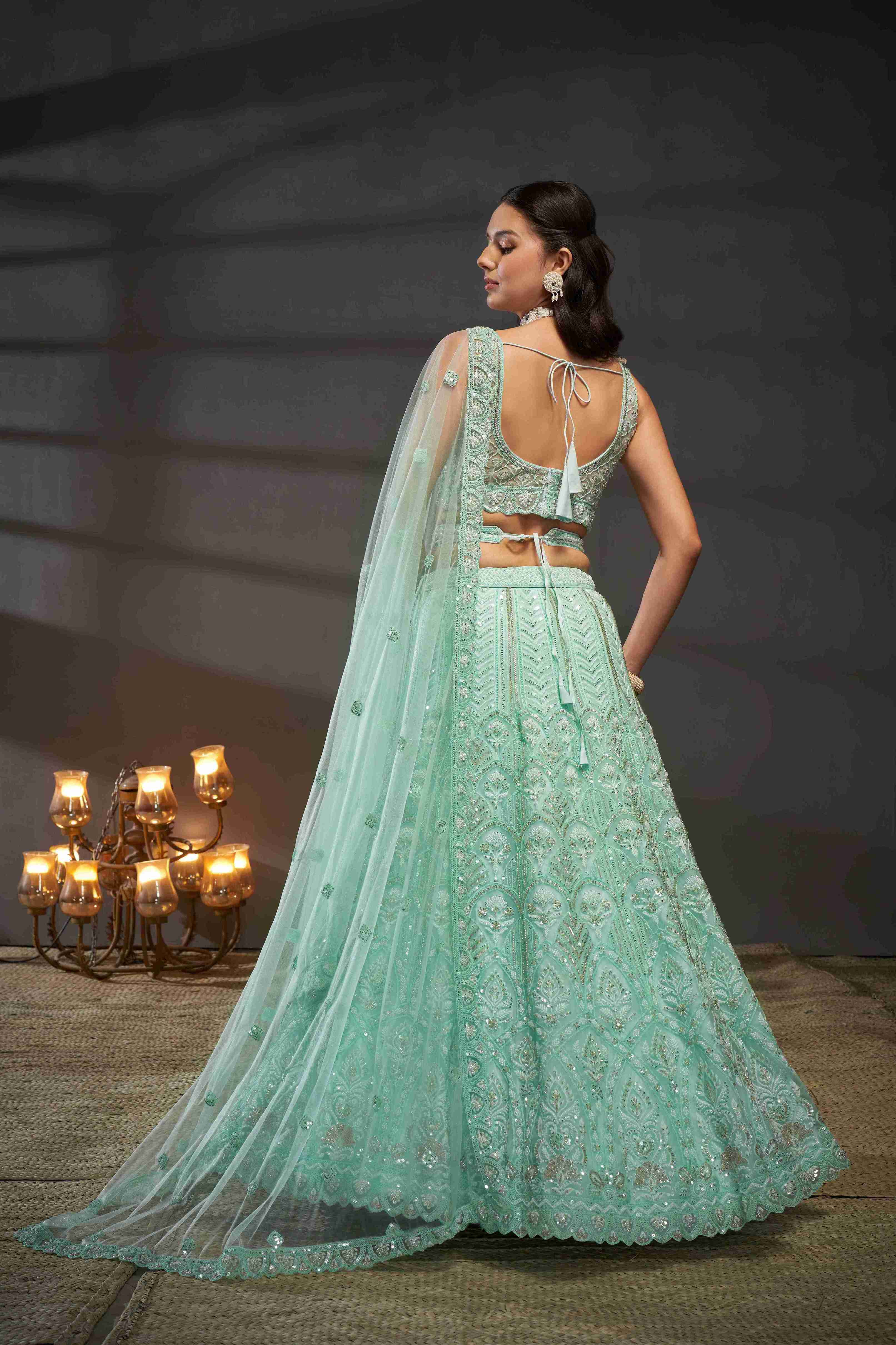 Turquoise  Net Thread Sequins Embroidered Lehenga Choli