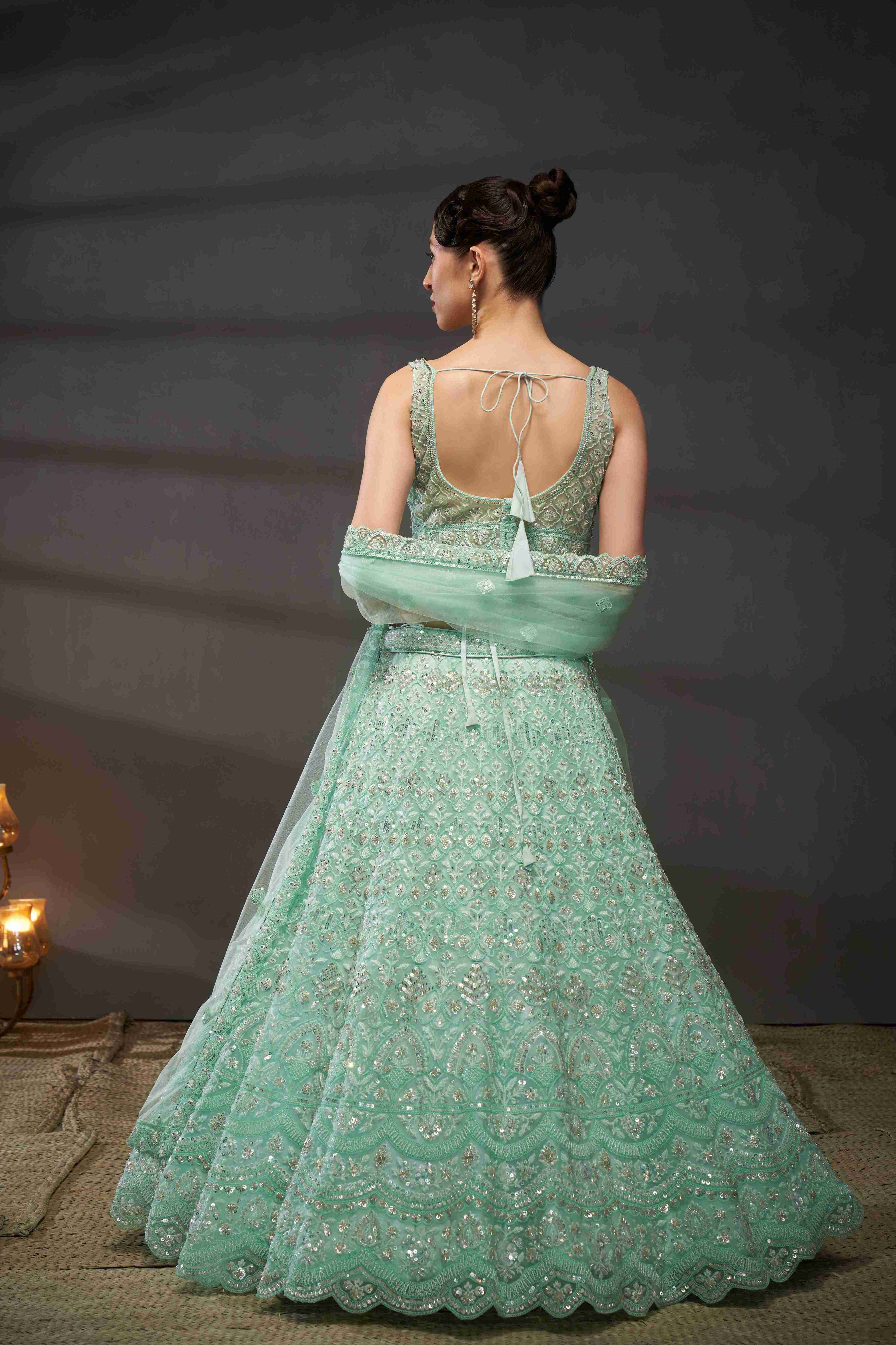 Turquoise  Net Thread Sequins Embroidered Lehenga Choli