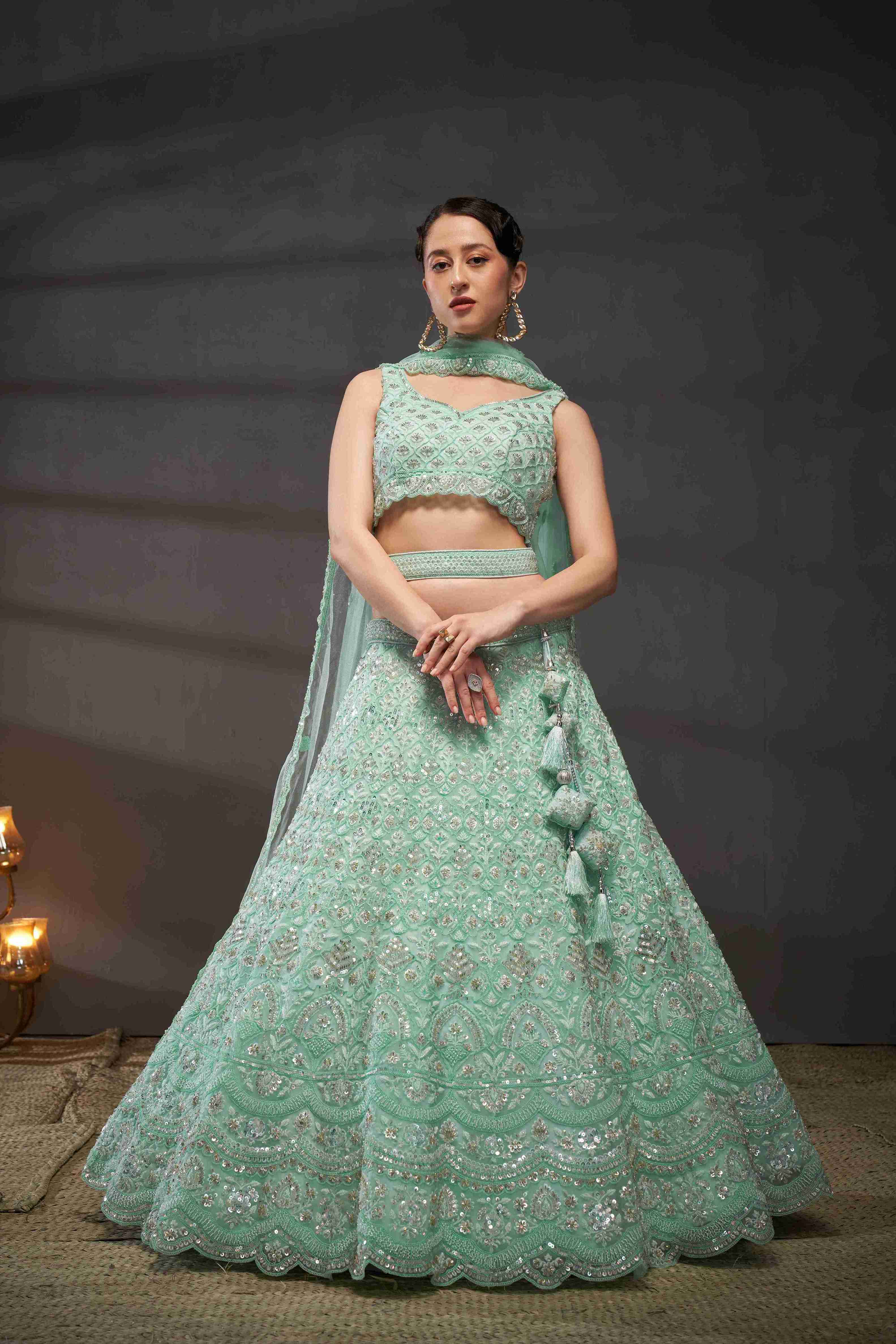 Turquoise  Net Thread Sequins Embroidered Lehenga Choli