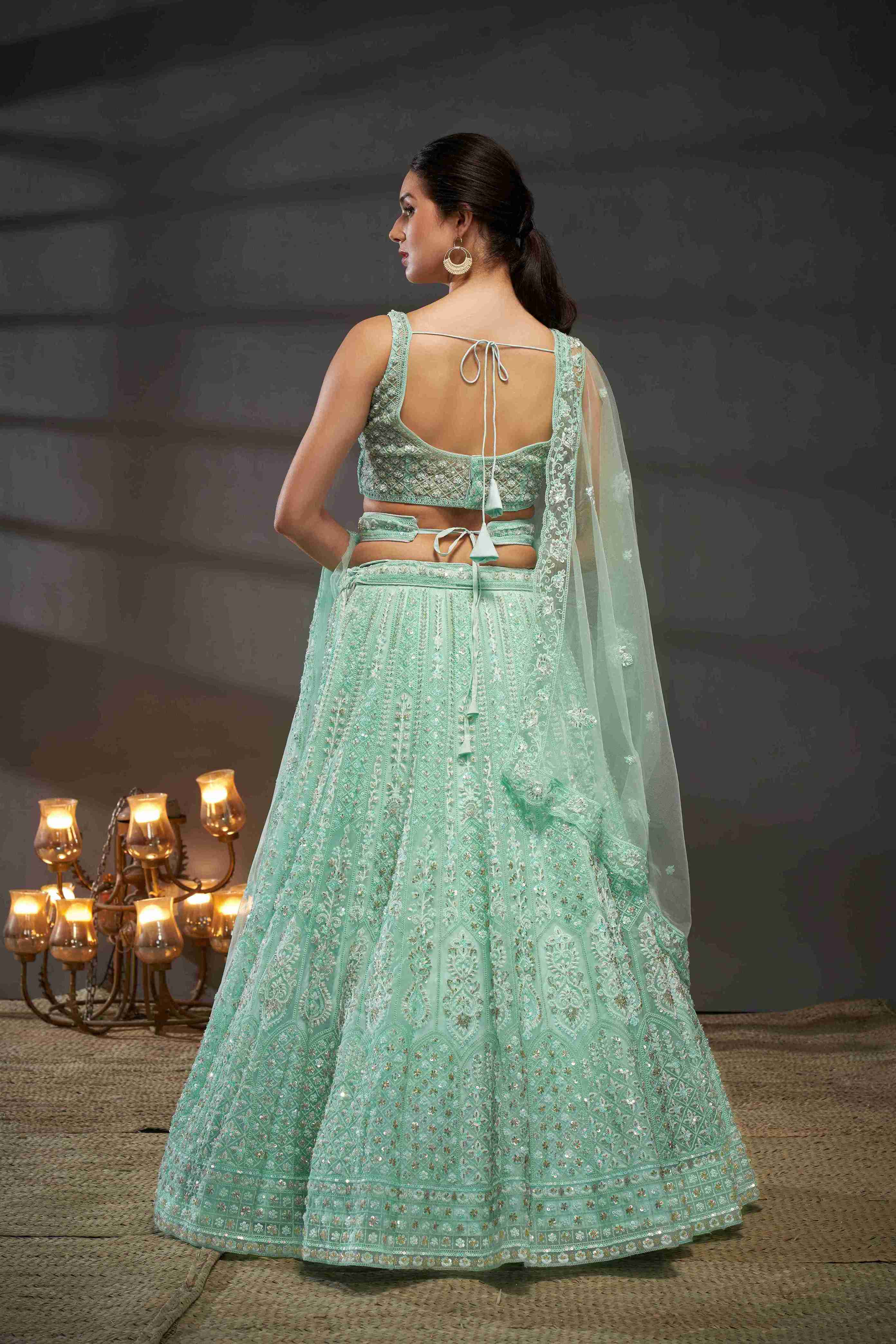 Turquoise  Net Thread Sequins Embroidered Lehenga Choli