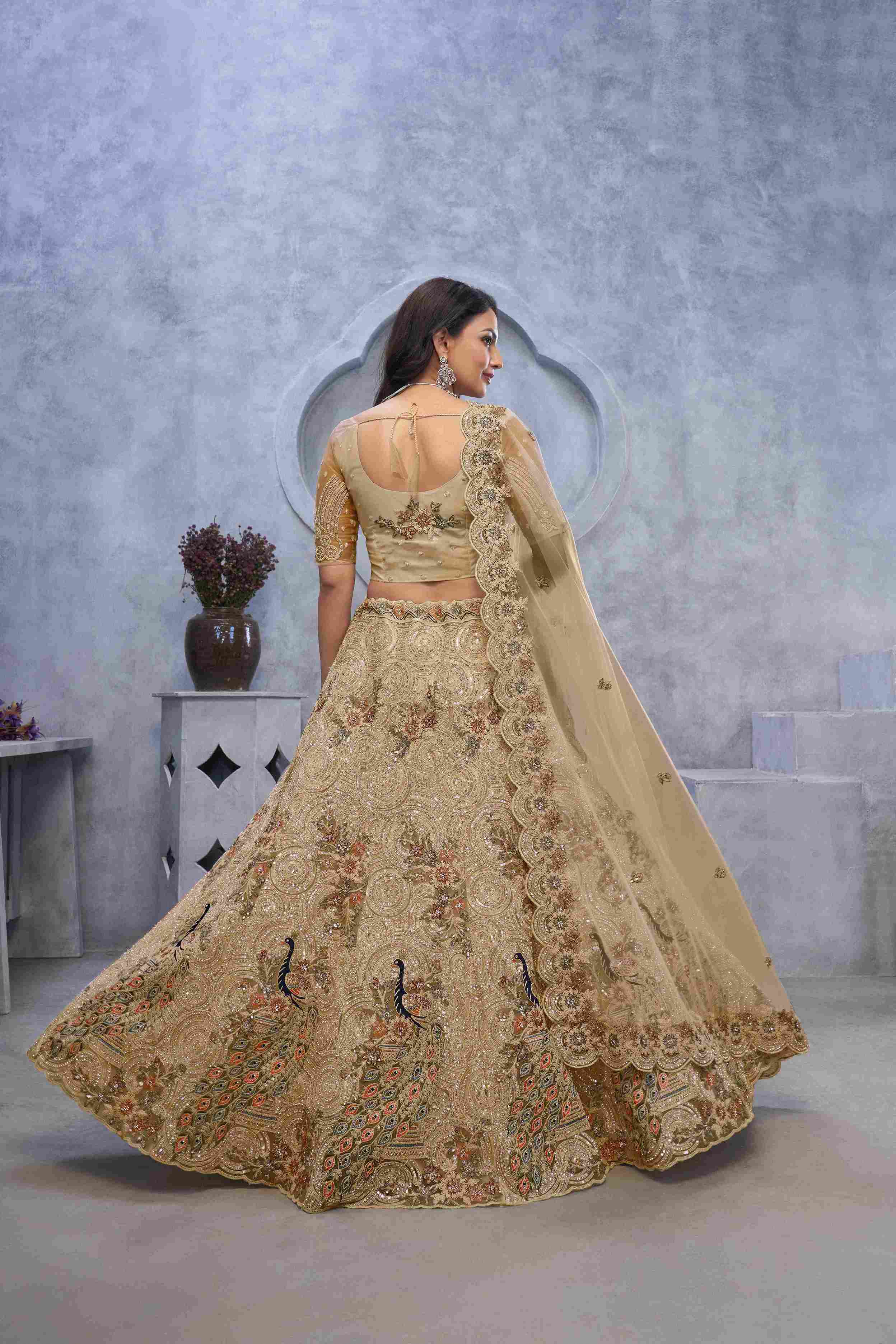 Golden Soft Net Embroidered Peacock Motif Lehenga Choli